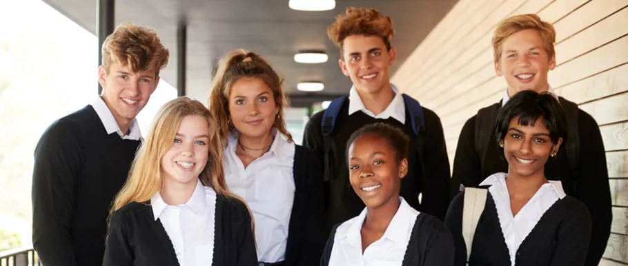 Students socialising on a Swiss boarding school campus balcony in Switzerland