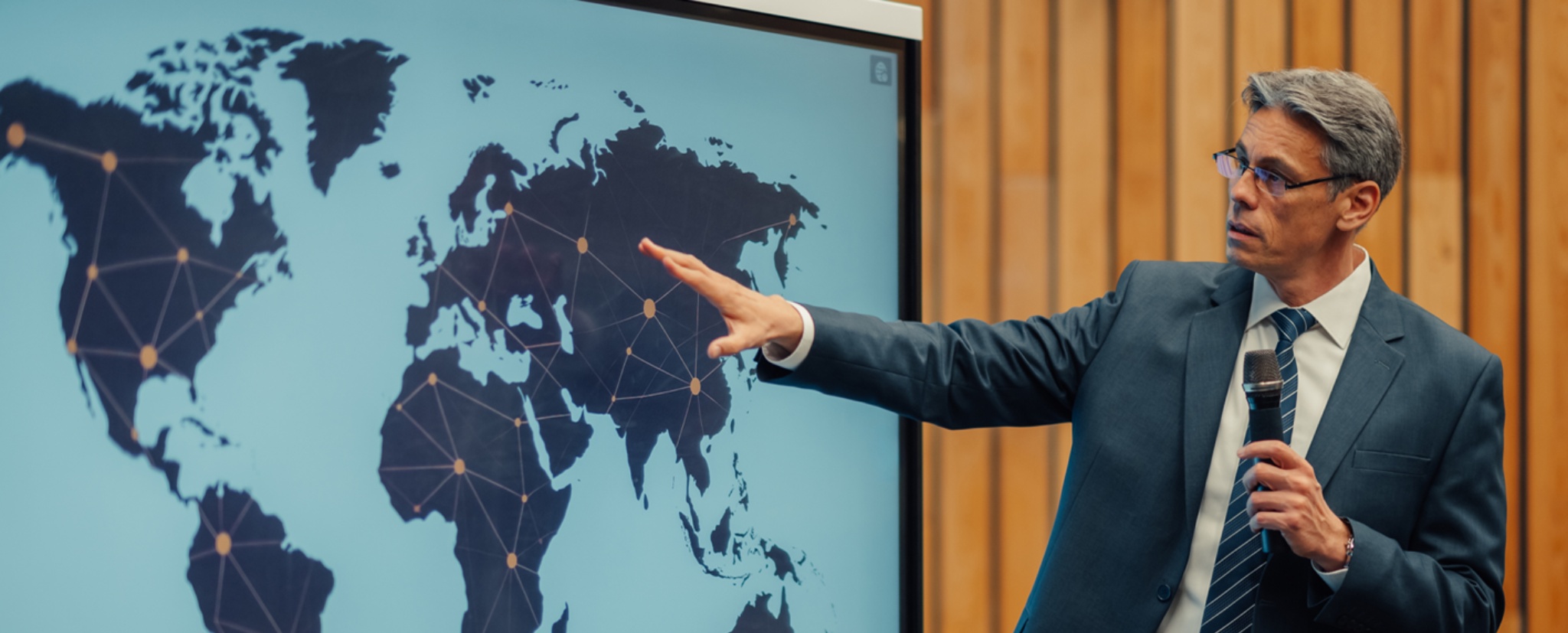 Senior advisor presenting global Swiss education strategy with international network connections 