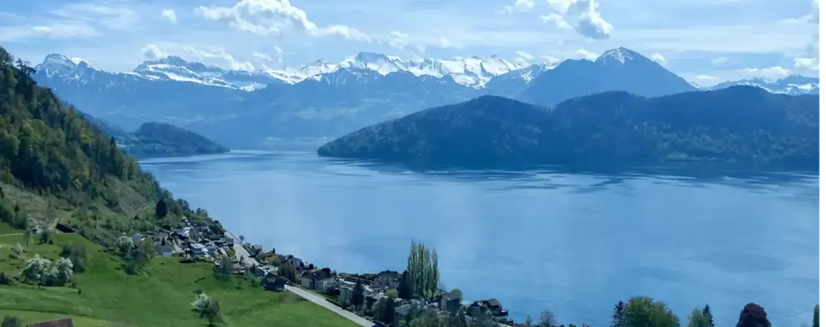 Swiss lake and mountain landscape representing premium education environment and lifestyle in Switzerland