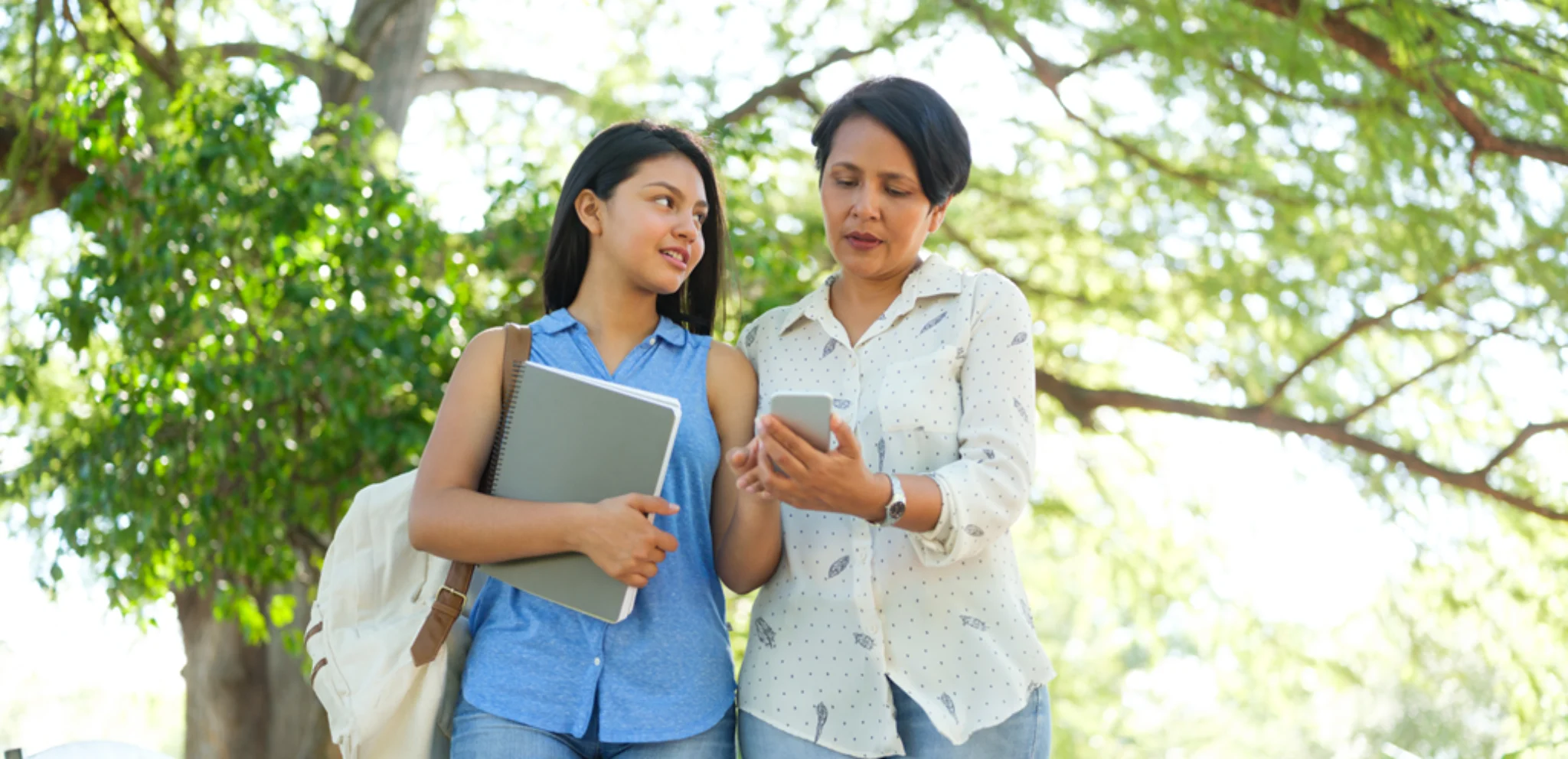 Parent and student visiting a Swiss boarding school campus and discussing academic options