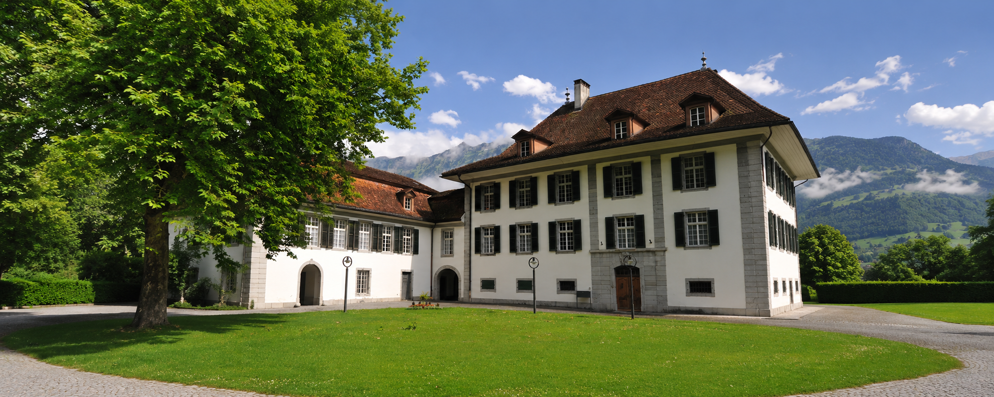 Swiss boarding school campus overlooking lake and mountains in Switzerland